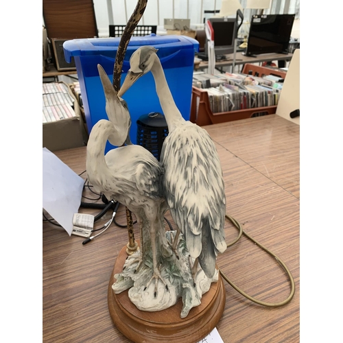 1204A - A CERAMIC PAIR OF HERONS TABLE LAMP WITH MARK  ON A WOODEN BASE