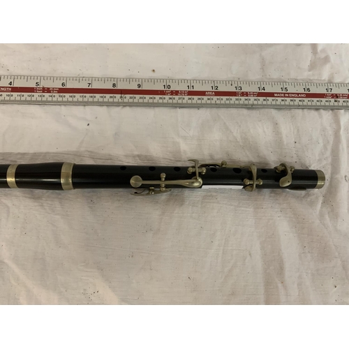 27 - A BARNES AND MULLINS BLACK MILITARY FLUTE WITH A CROWS FOOT