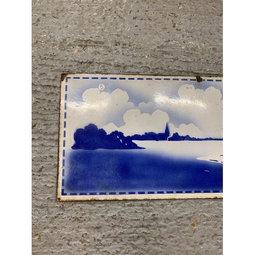 214 - A VINTAGE ENAMEL SIGN DEPICTING A DUTCH WINDMILL SCENE 48 INCHES X 15 INCHES