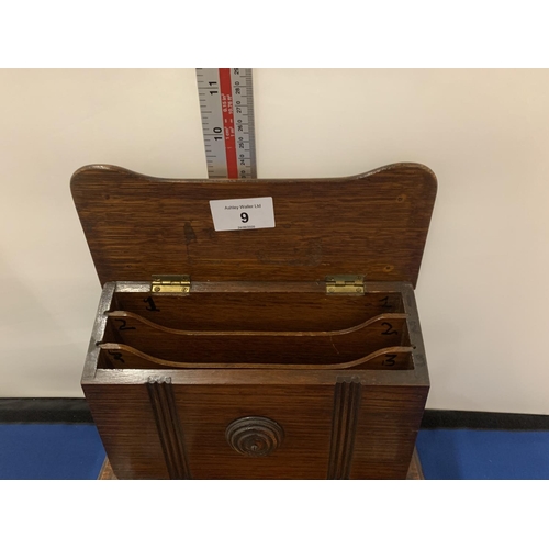 9 - A VICTORIAN WOODEN DESK SET WITH TWO GLASS INKWELLS AND A LETTER RACK