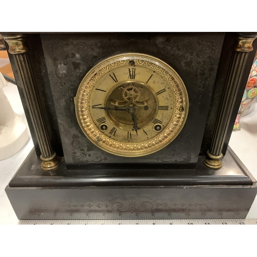 34 - AN ORNATE SLATE MANTLE CLOCK