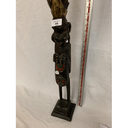 44 - A WOODEN CARVED AFRICAN TRIBAL FIGURE