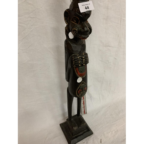 44 - A WOODEN CARVED AFRICAN TRIBAL FIGURE