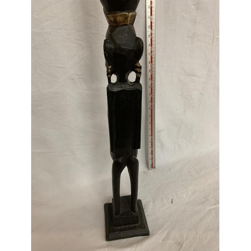 44 - A WOODEN CARVED AFRICAN TRIBAL FIGURE