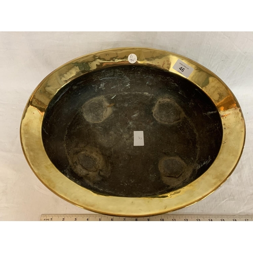 46 - A BRASS OVAL BOWL ON CLAW FEET