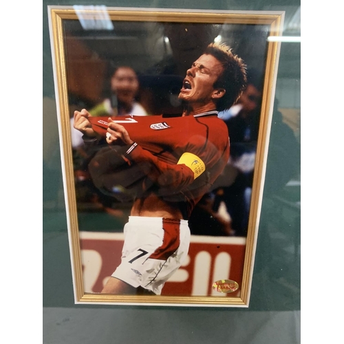 65 - A FRAMED DAVID BECKHAM PICTURE TOGETHER WITH A SIGNED MINI FOOTBALL WITH A CERTIFICATE OF AUTHENTICI... 