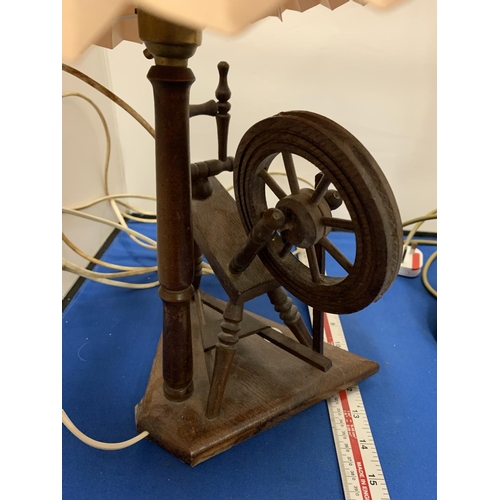 206 - A VINTAGE OAK SPINNING WHEEL LAMP AND A FURTHER  CERAMIC EXAMPLE