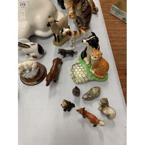 219 - A LARGE COLLECTION OF ANIMAL THEMED ORNAMENTS TO INCLUDE A LARGE JACK RUSSEL, CATS, BORDER FINE ART ... 