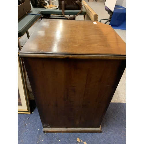 294 - A MAHOGANY WINE RACK WITH A CUPBOARD TO HOLD SIX WINE GLASSES