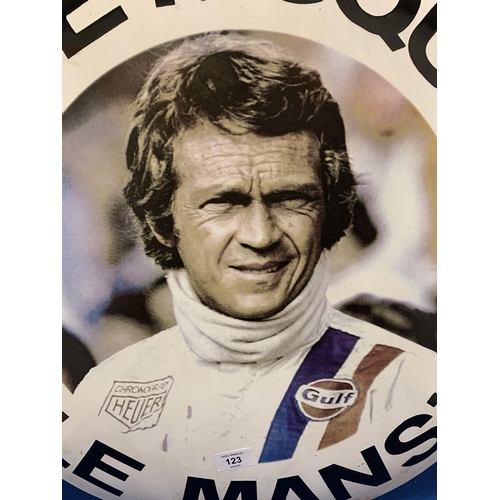 123 - AN ENAMEL STEVE McQUEEN LE MANS CIRCULAR SIGN