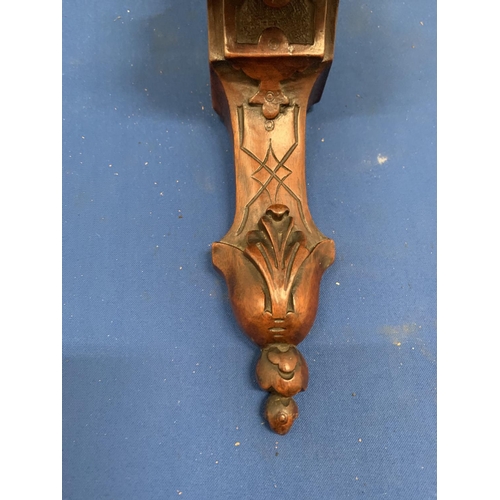 144 - A CARVED MAHOGANY WALL SCONCE