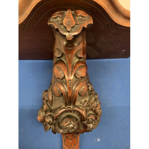 144 - A CARVED MAHOGANY WALL SCONCE