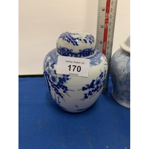 170 - TWO BLUE AND WHITE PAINTED LIDDED JARS ONE A/F (CRACK)