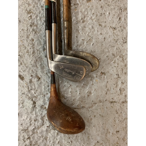 186 - FOUR VINTAGE GOLF CLUBS