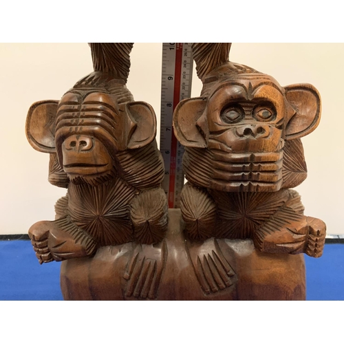 192 - A LARGE WOODEN MONKEY CARVING ' SEE NO EVIL, SPEAK NO EVIL, HEAR NO EVIL'