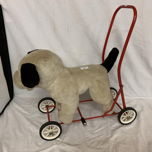 31 - A VIC-TREE TOY DOG ON WHEELS