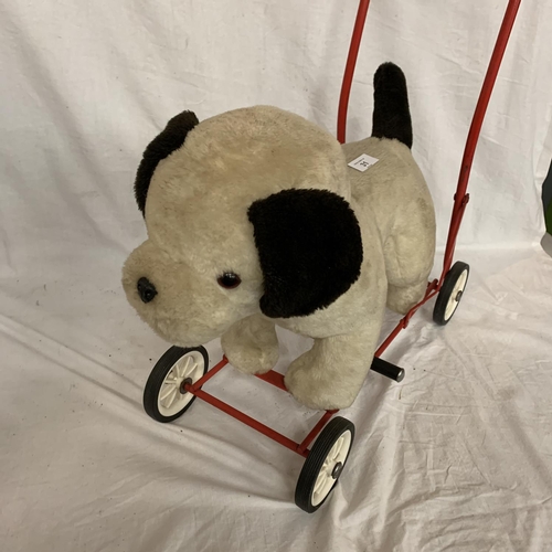 31 - A VIC-TREE TOY DOG ON WHEELS