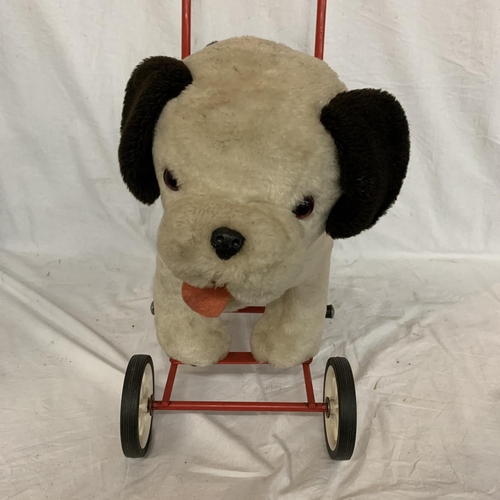 31 - A VIC-TREE TOY DOG ON WHEELS