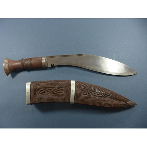 389 - A KUKRI KNIFE WITH CARVED SCABBARD - 28 CM BLADE