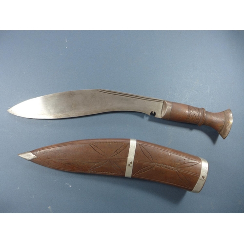 389 - A KUKRI KNIFE WITH CARVED SCABBARD - 28 CM BLADE