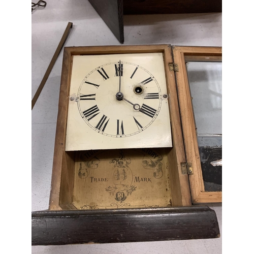 153 - A CHIMING MANTLE CLOCK IN NEED OF REPAIR