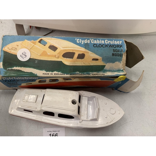 166 - TWO VINTAGE CHILDRENS' TOY BOATS TO INCLUDE A TRIANG DERWENT CABIN CRUISER AND A CLYDE CLOCKWORK CAB... 