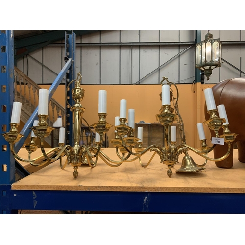 18 - A PAIR OF HEAVY SOLID BRASS EIGHT BRANCH CHANDELIERS