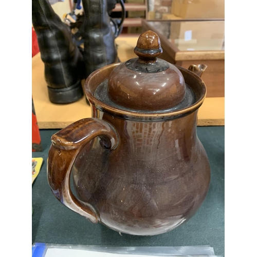 194 - A LARGE TREACLE GLAZE TEAPOT