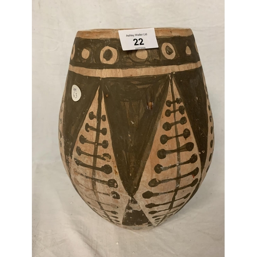 22 - A TERRACOTTA HAND MADE POT WITH A GEOMETRICAL DESIGN