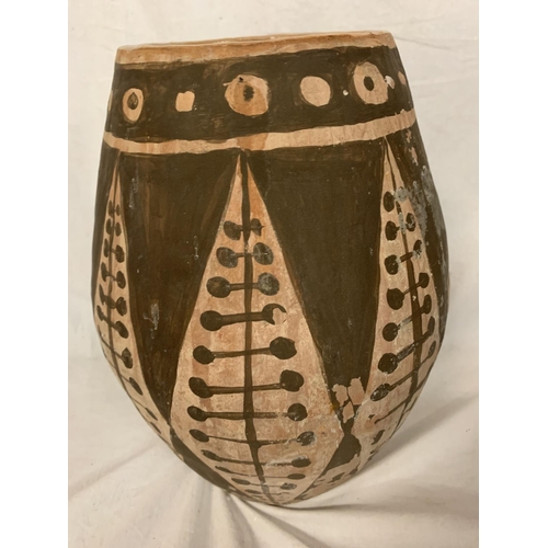 22 - A TERRACOTTA HAND MADE POT WITH A GEOMETRICAL DESIGN