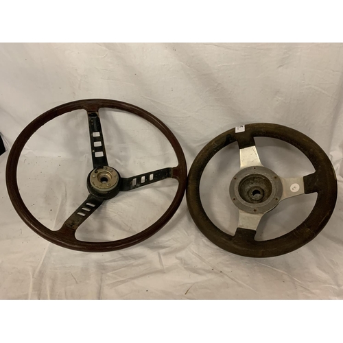 24 - TWO VINTAGE STEERING WHEELS