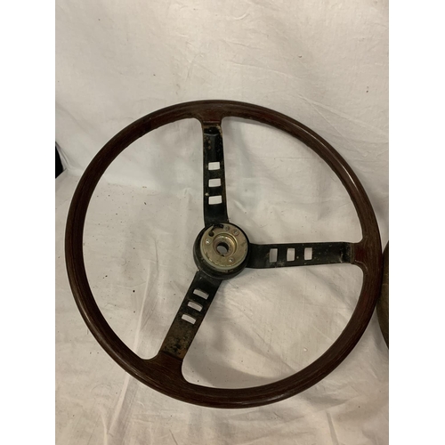 24 - TWO VINTAGE STEERING WHEELS