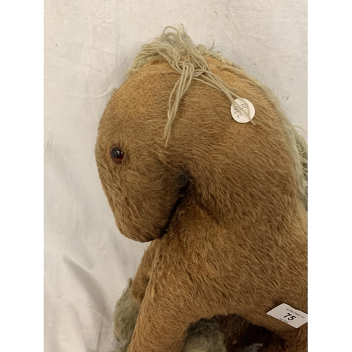 75 - TWO VINTAGE TEDDIES TO INCLUDE A HORSE AND AN ELEPHANT ON WHEELS