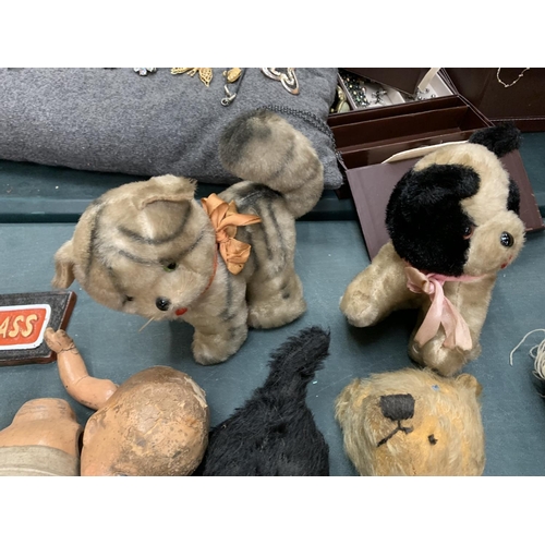 76 - A COLLECTION OF SEVEN VINTAGE TEDDIES AND A DOLL