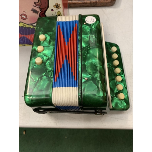 9 - A VINTAGE BOXED CHILDRENS ACCORDION