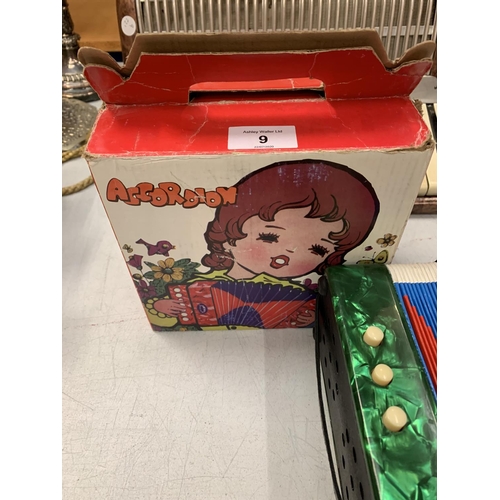 9 - A VINTAGE BOXED CHILDRENS ACCORDION