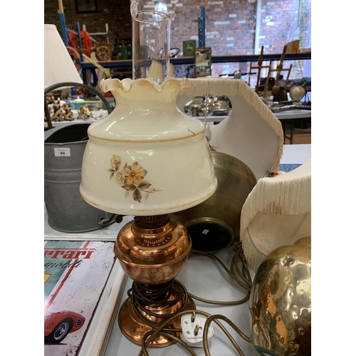 92 - THREE TABLE LAMPS TO INCLUDE A COPPER OIL LAMP STYLE BASE WITH GLASS SHADE AND TWO BRASS STYLE