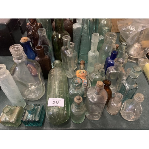 218 - A LARGE COLLECTION OF VINTAGE BOTTLES