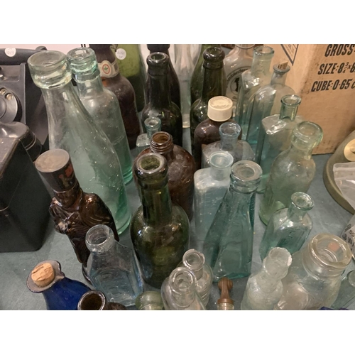 218 - A LARGE COLLECTION OF VINTAGE BOTTLES