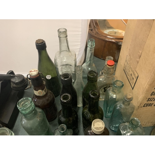 218 - A LARGE COLLECTION OF VINTAGE BOTTLES