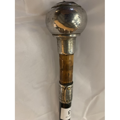 223 - A WOOD AND WHITE METAL WALKING CANE WITH ORNATE TOP AND ENGRAVED FINALE