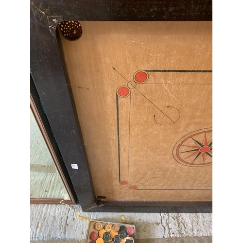 253 - A LARGE VINTAGE WOODEN FRAMED CARROM BOARD WITH A BOX OF COUNTERS