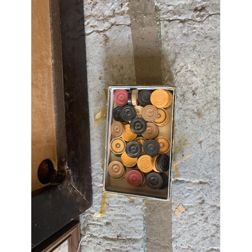 253 - A LARGE VINTAGE WOODEN FRAMED CARROM BOARD WITH A BOX OF COUNTERS