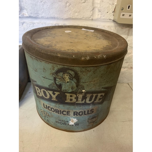 273 - A VINTAGE BOY BLUE LICORICE ROLLS TIN