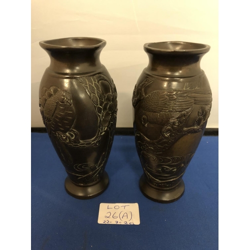 26A - A PAIR OF ORIENTAL BRONZE VASES DEPICTING AN EAGLE HUNTING FISH A/F 15.5 CM