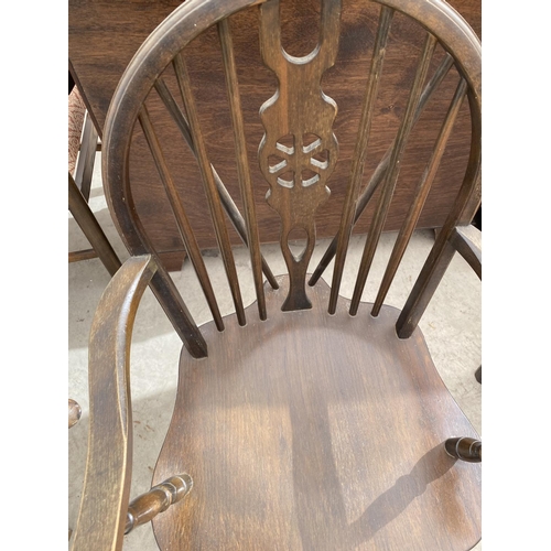 2137 - AN OAK WHEELBACK CARVER DINING CHAIR