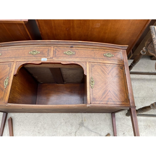 2140 - AN INLAID MAHOGANY BOW FRONT SIDEBOARD WITH TWO DOORS AND TWO DRAWERS - LEG REQUIRES REPAIR