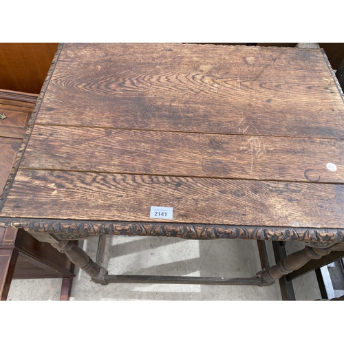 2141 - A VICTORIAN CARVED OAK SIDE TABLE