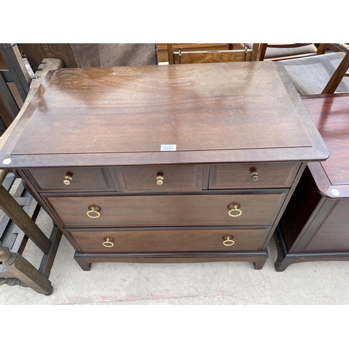 2143 - THREE STAG MINSTREL MAHOGANY ITEMS - A BEDSIDE CABINET, A CHEST OF THREE SMALL AND TWO LONG DRAWERS ... 