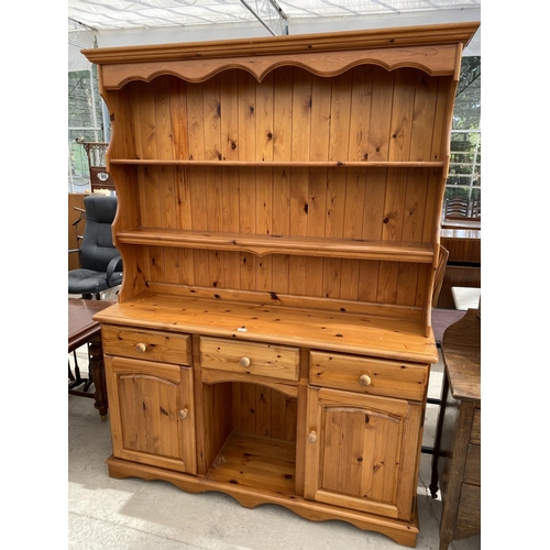 2152 - A PINE DRESSER WITH TWO DOORS, THREE DRAWERS AND UPPER PLATE RACK